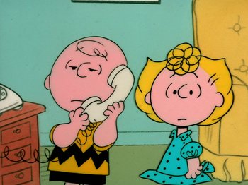Movie still from “A Charlie Brown Thanksgiving” (1973), directed by Phil Roman – A painting of charlie brown and sally on the wall; Medium shot, High angle