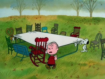 Movie still from “A Charlie Brown Thanksgiving” (1973), directed by Phil Roman – A charlie brown and snoopy cartoon scene with a table; Extreme Wide shot, High angle
