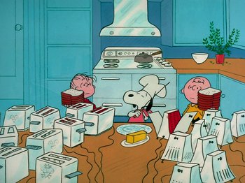 Movie still from “A Charlie Brown Thanksgiving” (1973), directed by Phil Roman – A group of people sitting at a table with food; Extreme Wide shot, Overhead angle