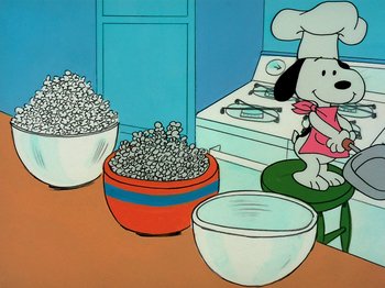 Movie still from “A Charlie Brown Thanksgiving” (1973), directed by Phil Roman – A painting of a dog sitting in front of bowls of popcorn; Extreme Wide shot, Low angle