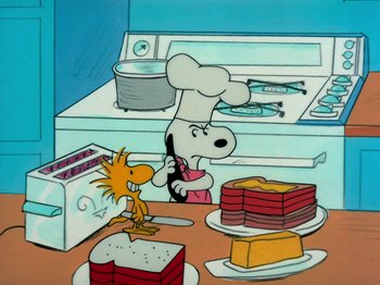 Movie still from “A Charlie Brown Thanksgiving” (1973), directed by Phil Roman – A painting of a chef snoopy and a cake; Extreme Wide shot, High angle