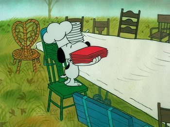 Movie still from “A Charlie Brown Thanksgiving” (1973), directed by Phil Roman – A cartoon picture of a dog holding a stack of papers; Extreme Wide shot, High angle
