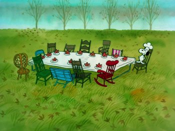 Movie still from “A Charlie Brown Thanksgiving” (1973), directed by Phil Roman – A table set for a meal in the middle of a field; Extreme Wide shot, High angle