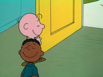 Movie still from “A Charlie Brown Thanksgiving” (1973), directed by Phil Roman – Two cartoon characters are standing in front of a yellow wall; Medium shot, High angle