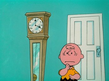Movie still from “A Charlie Brown Thanksgiving” (1973), directed by Phil Roman – A charlie brown character standing in front of a grandfather clock; Medium shot, High angle