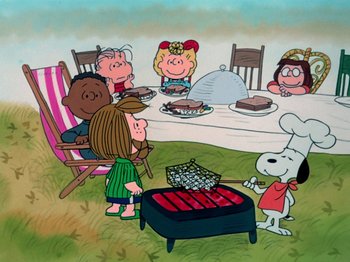 Movie still from “A Charlie Brown Thanksgiving” (1973), directed by Phil Roman – A group of people sitting around a table with food on top of it; Extreme Wide shot, High angle
