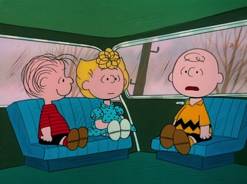 Movie still from “A Charlie Brown Thanksgiving” (1973), directed by Phil Roman – A group of people sitting in a car; Wide shot, High angle
