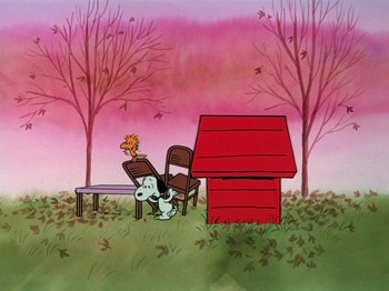 Movie still from “A Charlie Brown Thanksgiving” (1973), directed by Phil Roman – A painting of a dog sitting on a chair next to a dog house; Extreme Wide shot, High angle