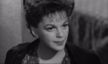 Movie still from “A Child Is Waiting” (1963), directed by John Cassavetes – An old photo of an older woman looking at the camera; Close Up shot, High angle