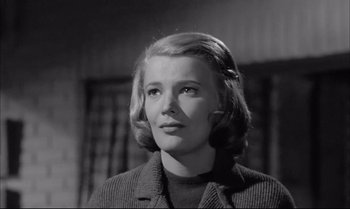 Movie still from “A Child Is Waiting” (1963), directed by John Cassavetes – A black - and - white photo of a woman looking at the camera; Close Up shot, Low angle