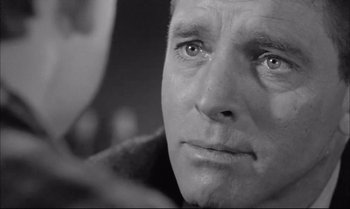 Movie still from “A Child Is Waiting” (1963), directed by John Cassavetes – An old photo of an older man looking at the camera; Close Up shot, Over the shoulder angle