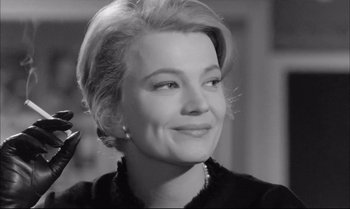 Movie still from “A Child Is Waiting” (1963), directed by John Cassavetes – A black - and - white photo of a woman smiling; Close Up shot, Low angle