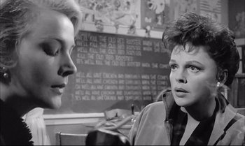Movie still from “A Child Is Waiting” (1963), directed by John Cassavetes – Two women are talking in front of a chalkboard; Close Up shot, Over the shoulder angle
