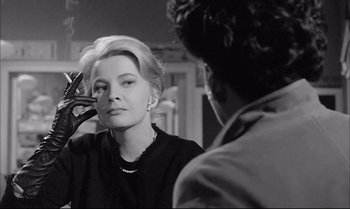 Movie still from “A Child Is Waiting” (1963), directed by John Cassavetes – A black and white photo of a woman looking at a man; Close Up shot, Over the shoulder angle