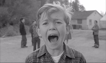 Movie still from “A Child Is Waiting” (1963), directed by John Cassavetes – A young boy with his mouth wide open; Close Up shot, High angle