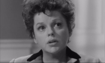 Movie still from “A Child Is Waiting” (1963), directed by John Cassavetes – A black - and - white photo of a woman looking at the camera; Close Up shot, High angle