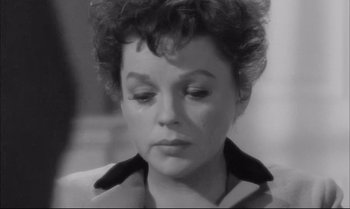 Movie still from “A Child Is Waiting” (1963), directed by John Cassavetes – A black - and - white photo of a woman crying; Close Up shot, High angle