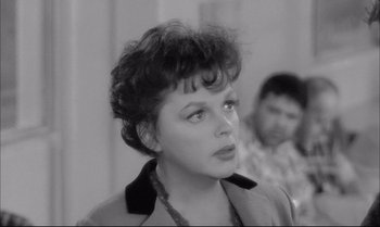 Movie still from “A Child Is Waiting” (1963), directed by John Cassavetes – An old photo of an older woman looking at the camera; Close Up shot, Over the shoulder angle