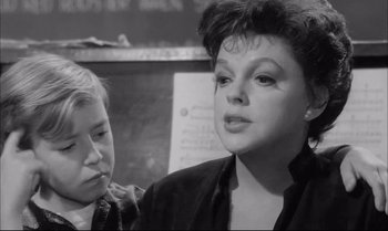Movie still from “A Child Is Waiting” (1963), directed by John Cassavetes – An older woman and a young boy are looking at each other; Close Up shot, High angle