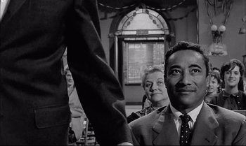 Movie still from “A Child Is Waiting” (1963), directed by John Cassavetes – A black and white photo of a man and a woman; Medium shot, Over the shoulder angle