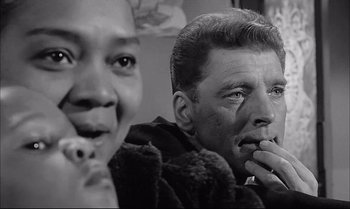 Movie still from “A Child Is Waiting” (1963), directed by John Cassavetes – A black and white photo of a man and a woman; Close Up shot, Low angle
