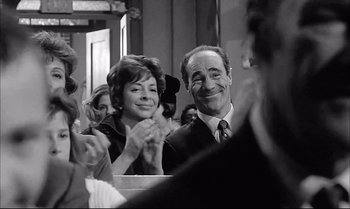 Movie still from “A Child Is Waiting” (1963), directed by John Cassavetes – A man and a woman sitting next to each other; Close Up shot, Over the shoulder angle