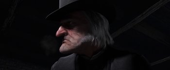 Movie still from “A Christmas Carol” (2009), directed by Robert Zemeckis – An old man wearing a black hat and a white beard; Close Up shot, Low angle