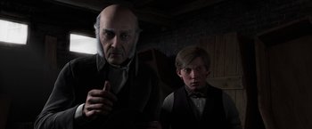 Movie still from “A Christmas Carol” (2009), directed by Robert Zemeckis – A man and a boy standing next to each other in a room; Close Up shot, Over the shoulder angle