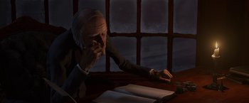 Movie still from “A Christmas Carol” (2009), directed by Robert Zemeckis – An older man sitting at a table with papers; Medium shot, Over the shoulder angle