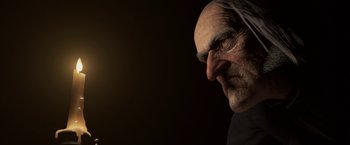 Movie still from “A Christmas Carol” (2009), directed by Robert Zemeckis – An old man's face is lit up by the sun; Close Up shot, Low angle