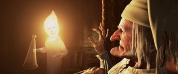 Movie still from “A Christmas Carol” (2009), directed by Robert Zemeckis – An old man and a young girl in a dimly - lit room; Close Up shot, Over the shoulder angle