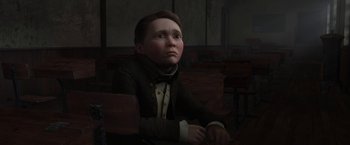 Movie still from “A Christmas Carol” (2009), directed by Robert Zemeckis – A boy sitting in a chair in a dark room; Medium shot, Over the shoulder angle