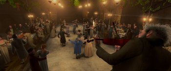Movie still from “A Christmas Carol” (2009), directed by Robert Zemeckis – A group of people dancing in a room with lights; Extreme Wide shot, High angle