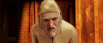 Movie still from “A Christmas Carol” (2009), directed by Robert Zemeckis – An old man wearing a white hat and a brown jacket; Close Up shot, Low angle