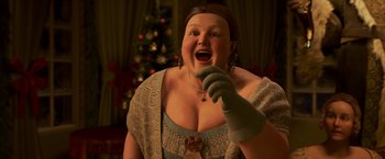 Movie still from “A Christmas Carol” (2009), directed by Robert Zemeckis – An animated woman in a dress with a christmas tree in the background; Close Up shot, High angle