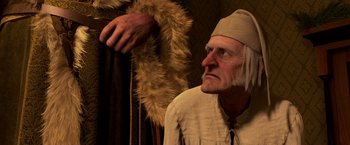 Movie still from “A Christmas Carol” (2009), directed by Robert Zemeckis – An old man wearing a hat and a fur coat; Close Up shot, Over the shoulder angle