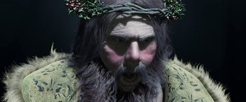 Movie still from “A Christmas Carol” (2009), directed by Robert Zemeckis – A man with a beard and a wreath on his head; Close Up shot, Overhead angle