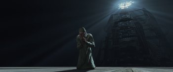 Movie still from “A Christmas Carol” (2009), directed by Robert Zemeckis – A man kneeling on the ground with his hands clasped; Wide shot, Low angle