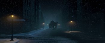 Movie still from “A Christmas Carol” (2009), directed by Robert Zemeckis – A horse drawn carriage traveling down a street at night; Extreme Wide shot, High angle