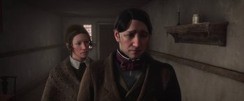 Movie still from “A Christmas Carol” (2009), directed by Robert Zemeckis – A man and a woman standing next to each other in a room; Close Up shot, Over the shoulder angle