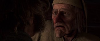 Movie still from “A Christmas Carol” (2009), directed by Robert Zemeckis – An old man with a beard is looking at another old man; Close Up shot, Over the shoulder angle