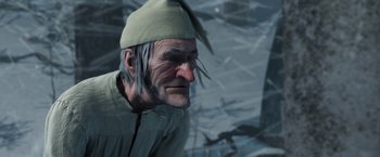 Movie still from “A Christmas Carol” (2009), directed by Robert Zemeckis – An old man wearing a green hat and a white shirt; Close Up shot, Low angle