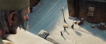 Movie still from “A Christmas Carol” (2009), directed by Robert Zemeckis – An aerial view of a street light and a sidewalk; Extreme Wide shot, High angle