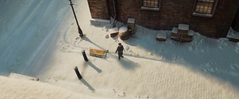 Movie still from “A Christmas Carol” (2009), directed by Robert Zemeckis – A man pulling a cart in the snow; Extreme Wide shot, High angle