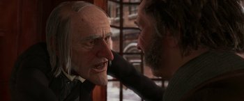 Movie still from “A Christmas Carol” (2009), directed by Robert Zemeckis – A man touching the face of another man's face; Close Up shot, Over the shoulder angle