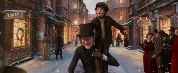 Movie still from “A Christmas Carol” (2009), directed by Robert Zemeckis – An old man and a young boy in the snow; Medium shot, Low angle