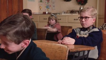 Movie still from “A Christmas Story” (1983), directed by Bob Clark – A group of children sitting at a table in a classroom; Medium shot, Over the shoulder angle