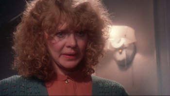 Movie still from “A Christmas Story” (1983), directed by Bob Clark – A person with curly red hair; Close Up shot, Over the shoulder angle