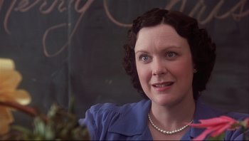 Movie still from “A Christmas Story” (1983), directed by Bob Clark – A person wearing a blue shirt; Close Up shot, Over the shoulder angle