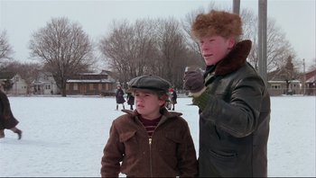 Movie still from “A Christmas Story” (1983), directed by Bob Clark – Two people standing next to each other in the snow; Medium shot, Low angle